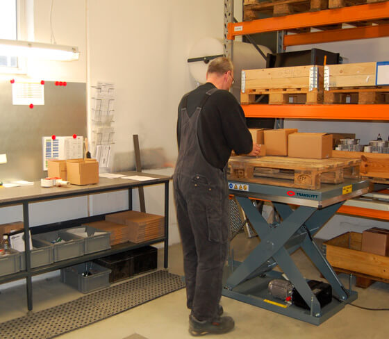 Scissor lift table in warehouse